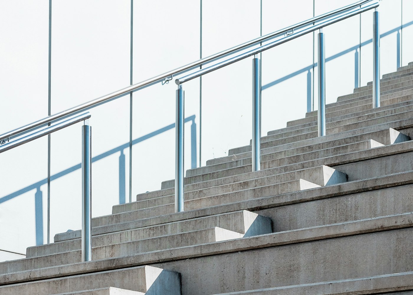 Modern glass-railed balcony at dusk